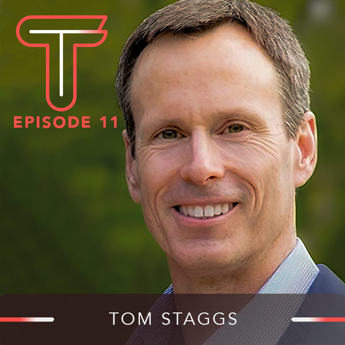 Headshot of a smiling Tom Staggs with the Titans as Teens logo in the background